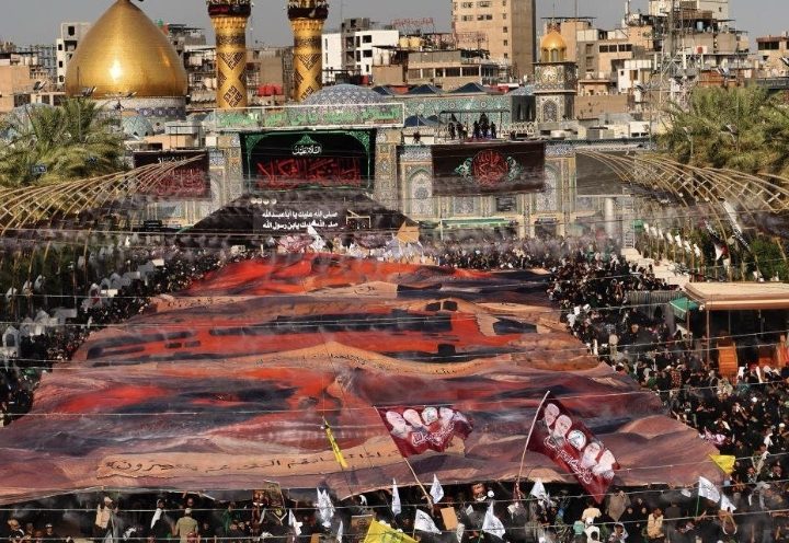الحشد الشعبي: رفع أكبر لوحة لتوثيق صور الشهداء بين الحرمين الشريفين